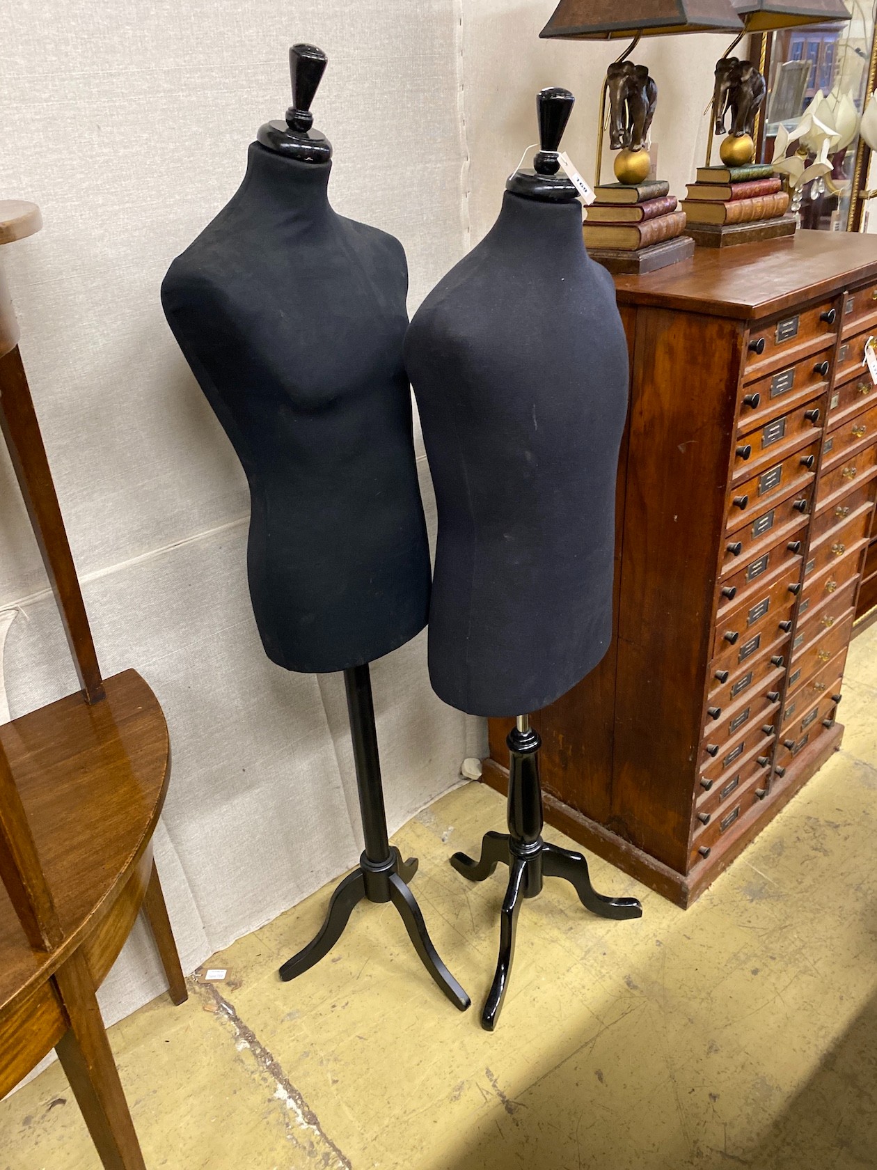 Two tailor's dummies on tripod stands, larger height 160cm